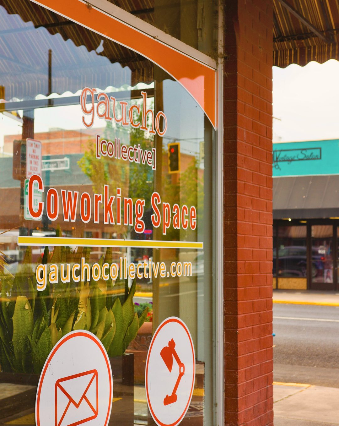 The gaucho [collective] Coworking Space lettering on the storefront window at 1038 Main Street