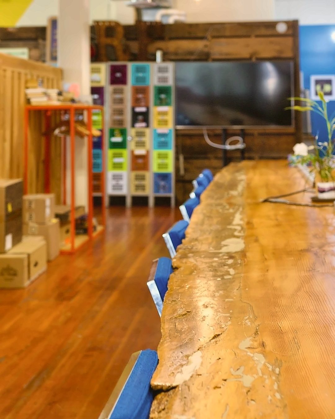 The long live-edge worktable on the main coworking floor at Gaucho Lounge in downtown Klamath Falls