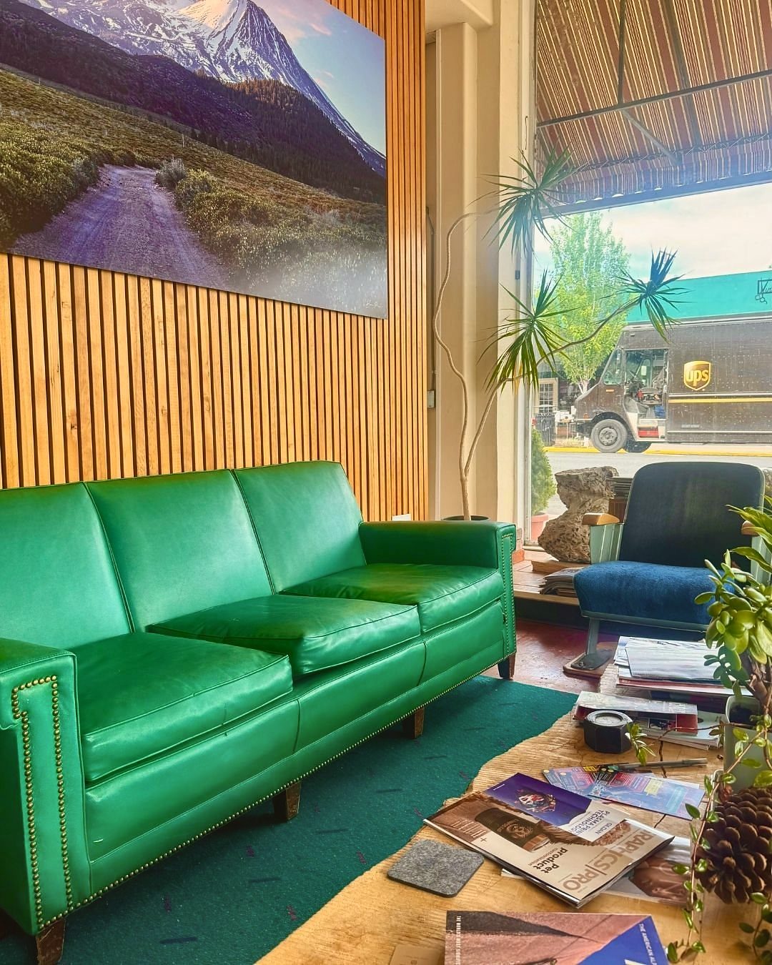Green leather sofa in the lounge area at Gaucho Lounge