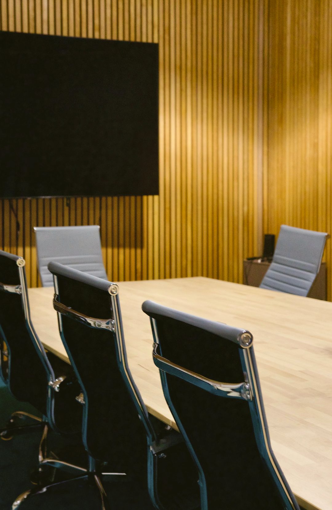 The conference room at Gaucho Lounge, with the wall screen and seating around the table